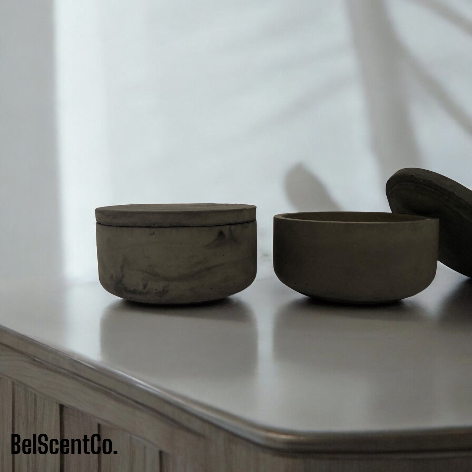 Black Concrete candle displayed on bench top- modern farmhouse style setting