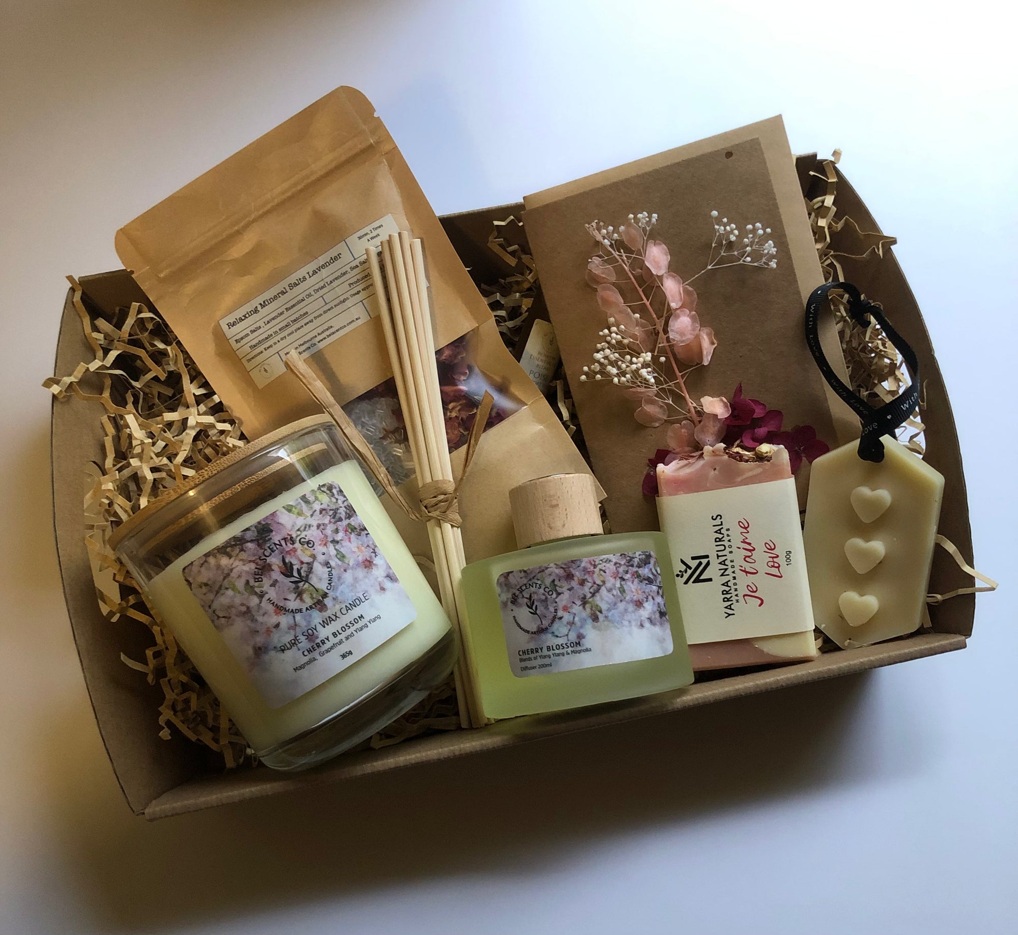 Gift Hamper on white background presented in Kraft box and packaging. With Cherry Blossom inspired products